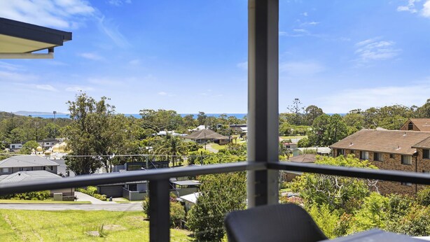 A balcony with a clear view of a residential area, including houses and greenery. - Top Town Terrace - short walk to town center (Woolgoolga)