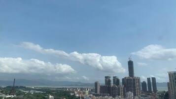 A cityscape with high-rise buildings and a clear sky.