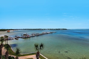 Enjoy a serene waterfront setting with a marina offering sailboats and motorboats.