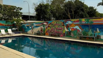 Outdoor pool, open 9:00 AM to 6:00 PM, pool umbrellas, pool loungers