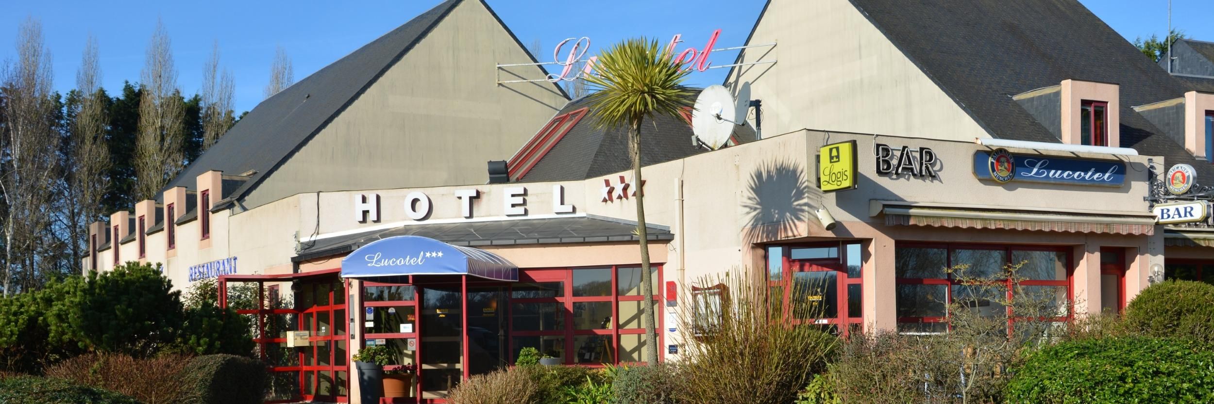 A hotel with a prominent sign, a bar, and a restaurant.