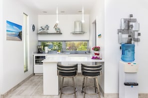 Fridge, microwave, stovetop, coffee/tea maker