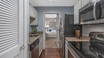 Microwave, stovetop, dishwasher, cookware/dishes/utensils