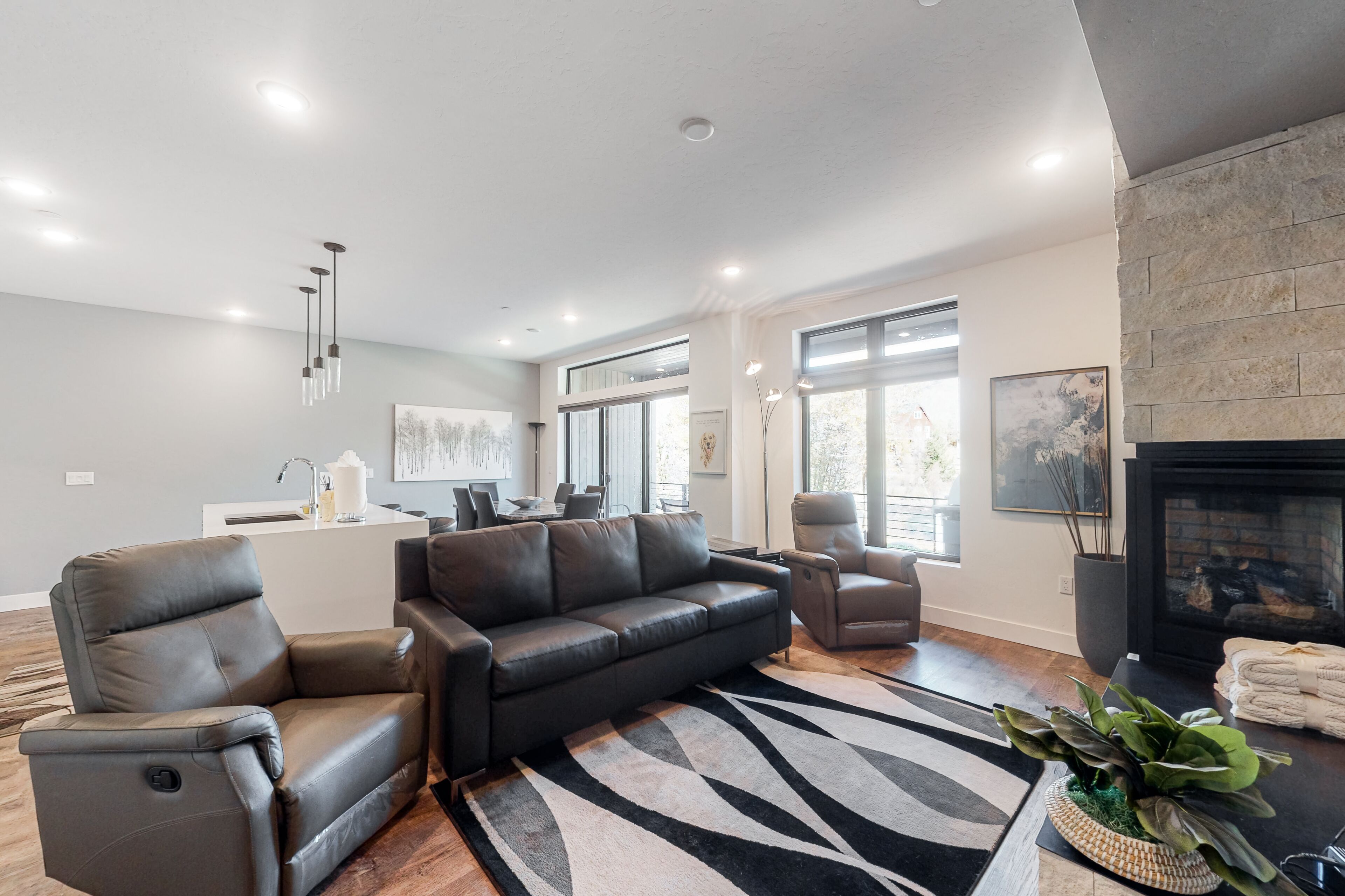 Modern Riverfront Condo with a Furnished Patio, Gas Fireplace, & Free WiFi