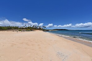 On the beach, sun loungers, beach towels