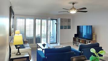 Condo, 1 King Bed, Pool View | Living area | TV