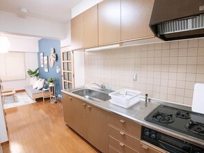 Apartment, 2 Bedrooms, Non Smoking, Balcony (301) | Private kitchen | Fridge, microwave, stovetop, electric kettle - OUCHI HOTEL Hijiyama (Hiroshima)