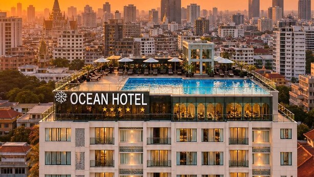 A hotel with multiple floors, balconies, and a rooftop pool area. - Ocean Hotel (Phnom Penh)