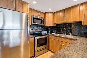 Fridge, microwave, oven, stovetop - 🌅 Unit 307 at Gulf Gate – Bay-View Serenity with Modern Comforts for 4 Guests (St Pete Beach)