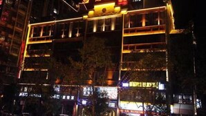 A hotel with multiple floors and illuminated signage. - Fortune Hotel (Taining)