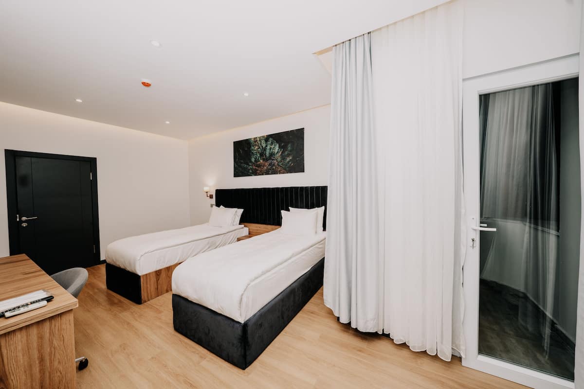Superior Twin Room | 1 bedroom, in-room safe, iron/ironing board, free cots/infant beds