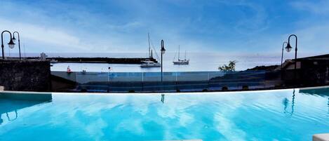 Outdoor pool, pool umbrellas, sun loungers