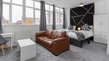 1 bedroom, desk, iron/ironing board, travel crib