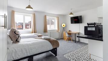 1 bedroom, desk, iron/ironing board, travel crib