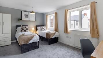 1 bedroom, desk, iron/ironing board, travel crib