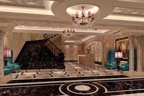 A grand lobby with a marble floor, a staircase, and a chandelier. - Yuanlin Hotel (Tongzi County)