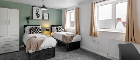 1 bedroom, desk, iron/ironing board, travel crib