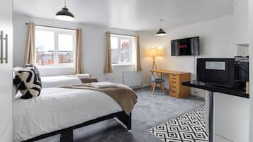 1 bedroom, desk, iron/ironing board, travel crib