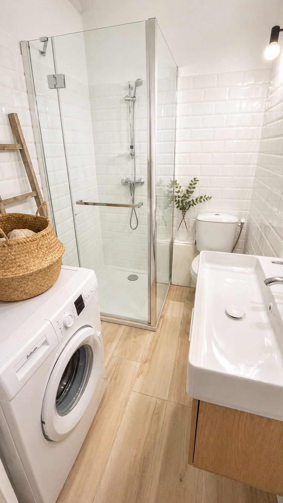 A modern bathroom with a glass-enclosed shower, a washing machine, a toilet, and a sink.