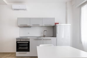 Fridge, oven, electric kettle, cookware/dishes/utensils