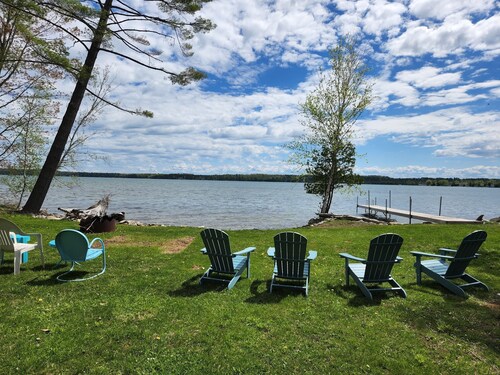 Waterfront log home on Elk Lake with dock and mooring, window A/C. Dog ok.