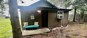 Waterfront log home on Elk Lake with dock and mooring, window A/C. Pet ok.