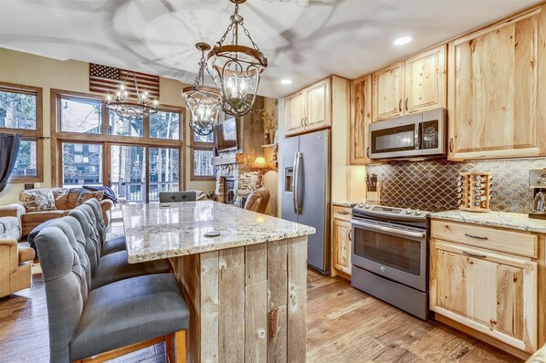 Enjoy cooking in this kitchen with a large island, double oven, and stainless steel appliances.