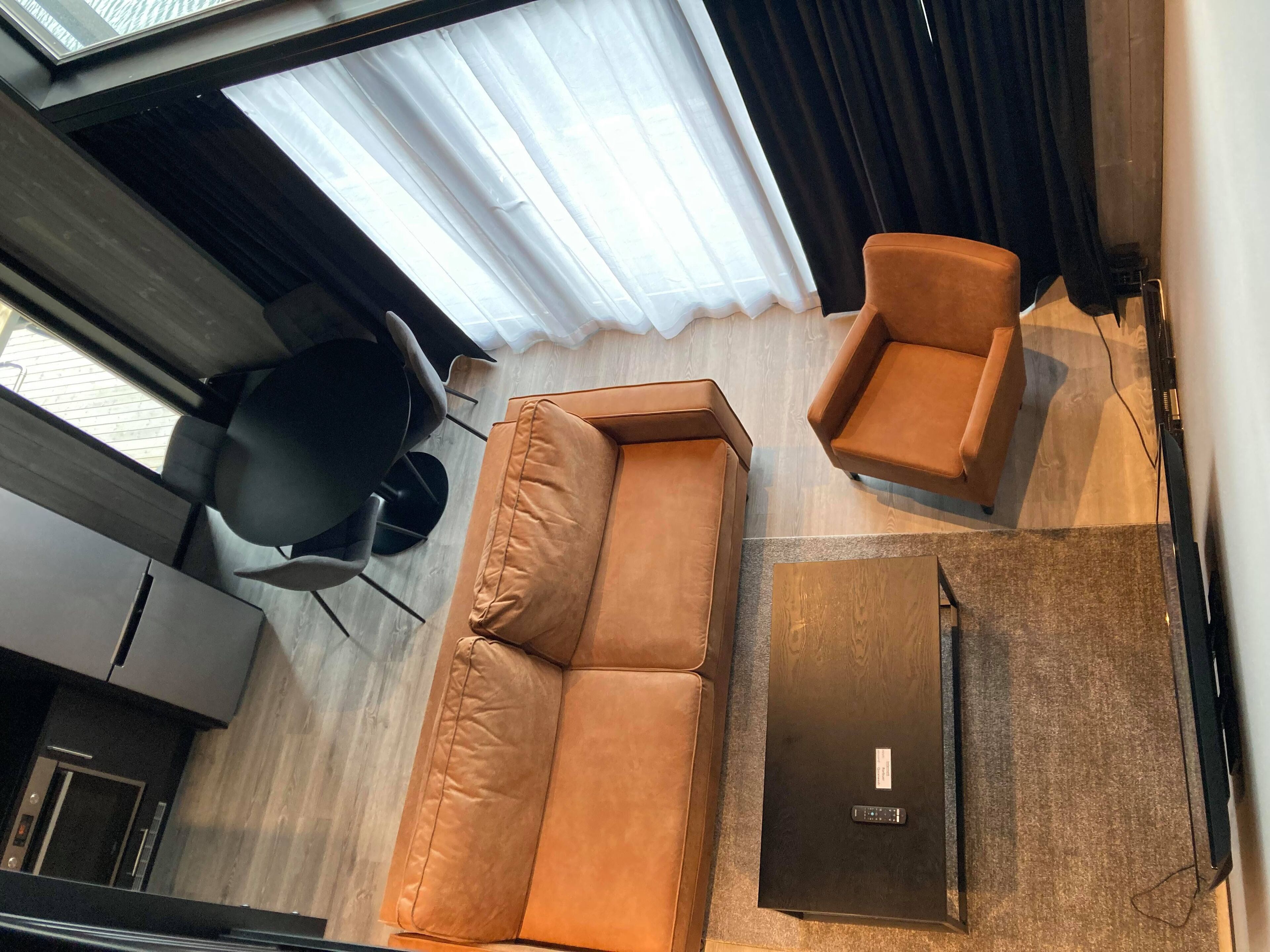 rorbue deluxe | living area | 43-inch smart tv with satellite channels, tv