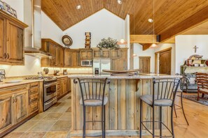Enjoy cooking in this well-equipped kitchen with a central island and bar area.