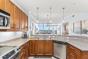 Enjoy cooking in this well-equipped kitchen with a microwave, coffee maker, and dishwasher.
