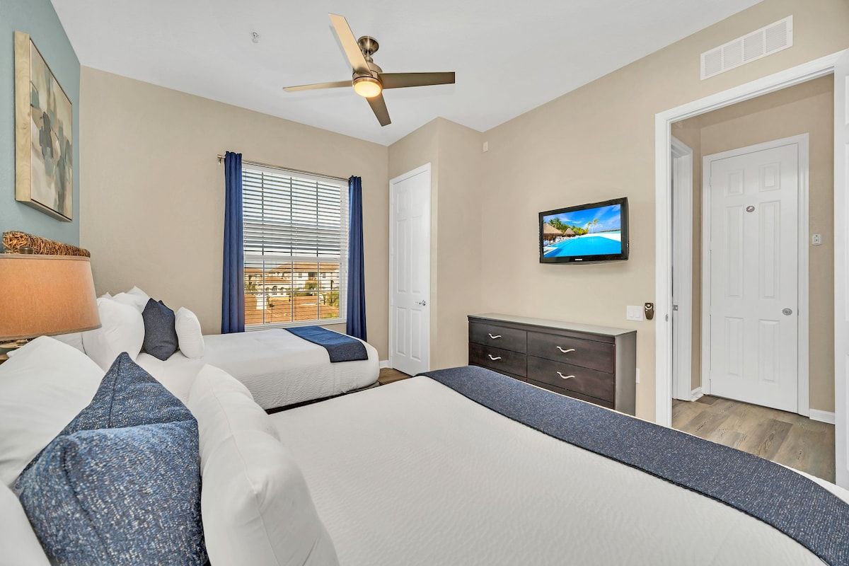 Shared Serenity: This bedroom with two beds offers a tranquil space for companionship and relaxation, where shared dreams and cherished moments intertwine amidst comfort and warmth.