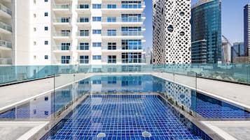 Outdoor pool, open 8:00 AM to 8:00 PM, pool loungers