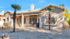 A house with a covered patio, outdoor seating, and palm trees. - FANTASTIC Scottsdale location! Close to Waste Management Open, and Westworld!! (Scottsdale)