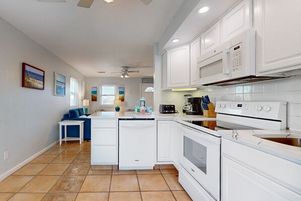 Enjoy cooking in this well-equipped kitchen with an oven, microwave, and stovetop.