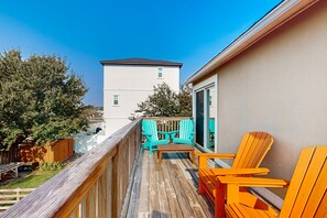 Enjoy a peaceful moment on this outdoor deck with a view of the surrounding building.