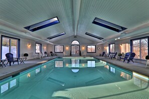 Relax by the pool surrounded by comfortable seating and stunning views.