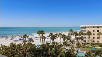 On the beach, sun loungers, beach towels