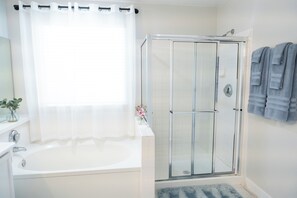 Combined shower/tub, hair dryer, towels, soap
