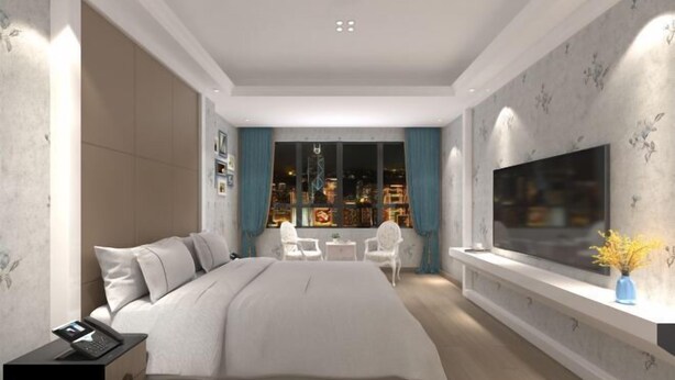 A modern bedroom with a large bed, bedside tables, a TV, and a city view through the window. - Feng Huang Business Hotel (Luxi)