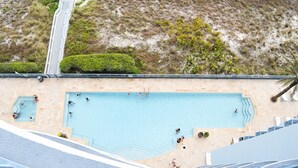 An aerial view of a swimming pool with multiple lanes, surrounded by a sandy beach and a pathway. - Sterling Breeze 2Bd/3Ba w/Bunk Room / Near Pier Park /Sleeps 8 (Panama City Beach)