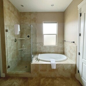 Combined shower/bathtub, hair dryer, towels, soap