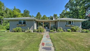 A two-story house with a stone pathway leading to the front door. - Modern Studio < 13 Mi to Saratoga Racetrack! (Ballston Spa)