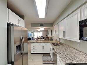 Condo, Multiple Beds, Garden View (#103-D - Pets) | Private kitchen | Fridge, microwave, oven, stovetop - Hibiscus by Distinctive Beach Rentals (St. Augustine)