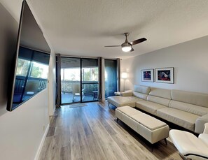 Condo, Multiple Beds, Garden View (#103-B - No Pets) | Living area | TV - Hibiscus by Distinctive Beach Rentals (St. Augustine)