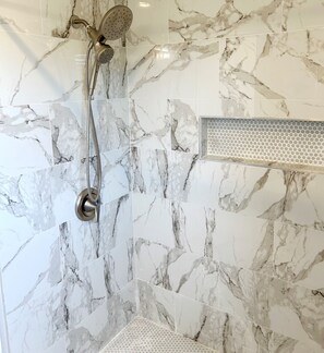 Combined shower/tub, hair dryer, towels, soap