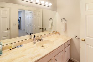 Combined shower/tub, hair dryer, towels, soap