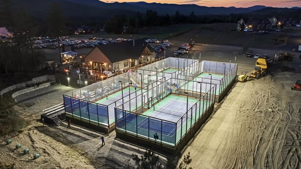 A large, multi-level sports facility with multiple courts, surrounded by a parking area and residential buildings. - Condo close to hiking, river, with mountain views (Thornton)