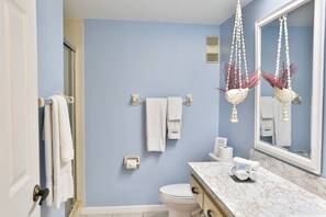 Shower, hair dryer, towels, shampoo