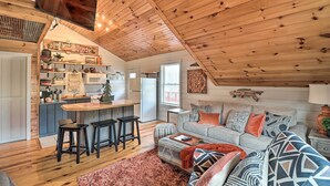 A cozy loft-style living space with a kitchen, dining area, and seating area. - Cheery Pet-Friendly Studio w/ Shared Fire Pit (Mountain View)