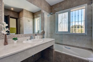 Bathtub, hair dryer, towels